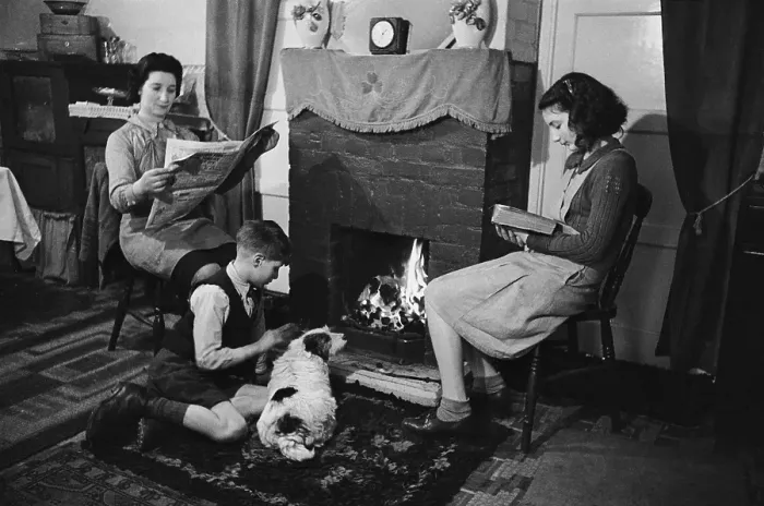 Framed Print : East End. 9th March 1946: A family sitting round the fire in a house in Framed Print : East End. 9th March 1946: A family sitting round the fire in a house in