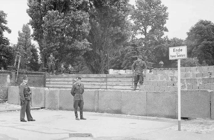 Framed Print : East German Soldier Working on Berlin Wall