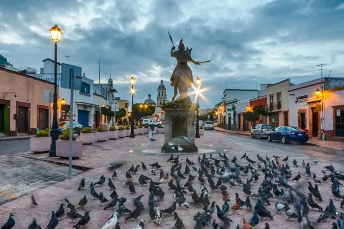 Framed Print : Ecuestre del ApAostol Santiago el Mayor statue, with many pigeons around it, in Queretaro, Mexico at dawn Framed Print : Ecuestre del ApAostol Santiago el Mayor statue, with many pigeons around it, in Queretaro, Mexico at dawn
