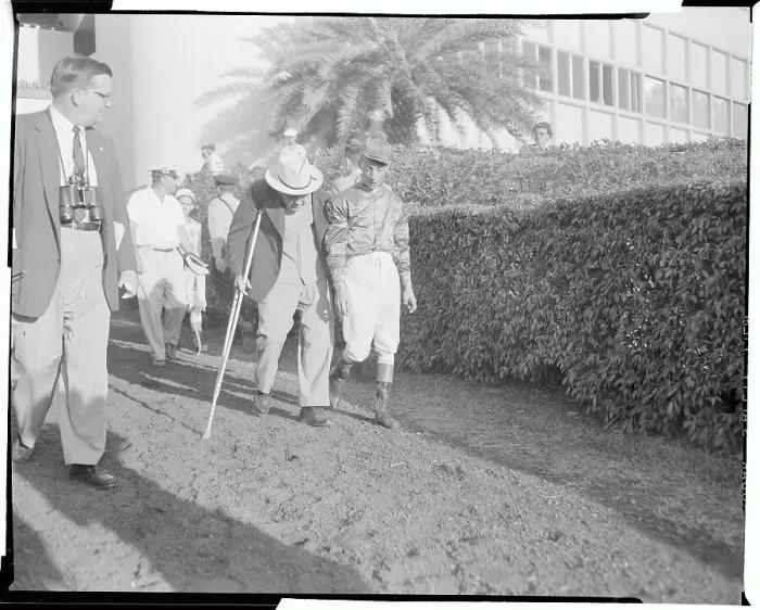 Framed Print : Eddie Arcaro and Sunny Jim Fitzsimmons Walking at Racetrack