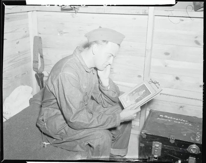 Framed Print : Eddie Fromm Looking at Photograph