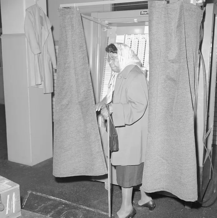Framed Print : Elderly African American Woman Exiting Voting Booth Framed Print : Elderly African American Woman Exiting Voting Booth