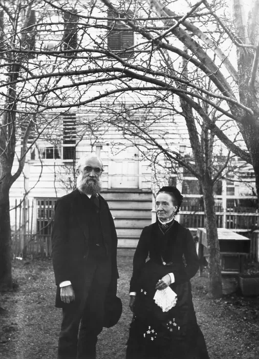 Framed Print : Elderly Couple Stand In Front Of Home Framed Print : Elderly Couple Stand In Front Of Home
