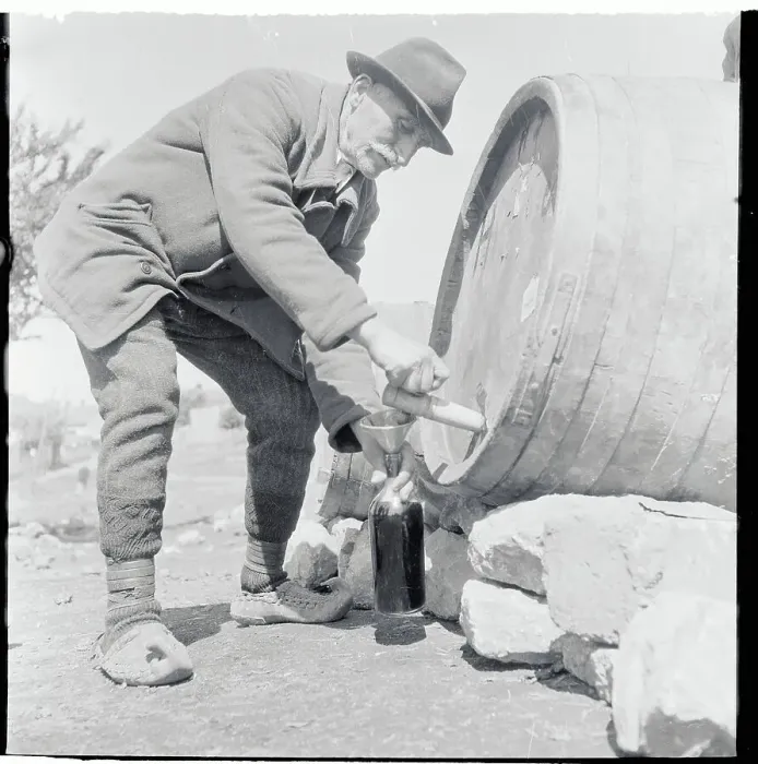 Framed Print : Elderly Man Draining Brew from Barrel Framed Print : Elderly Man Draining Brew from Barrel