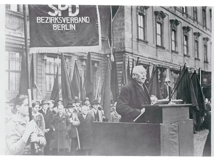 Framed Print : Elderly Man Speaking Outside at Podium