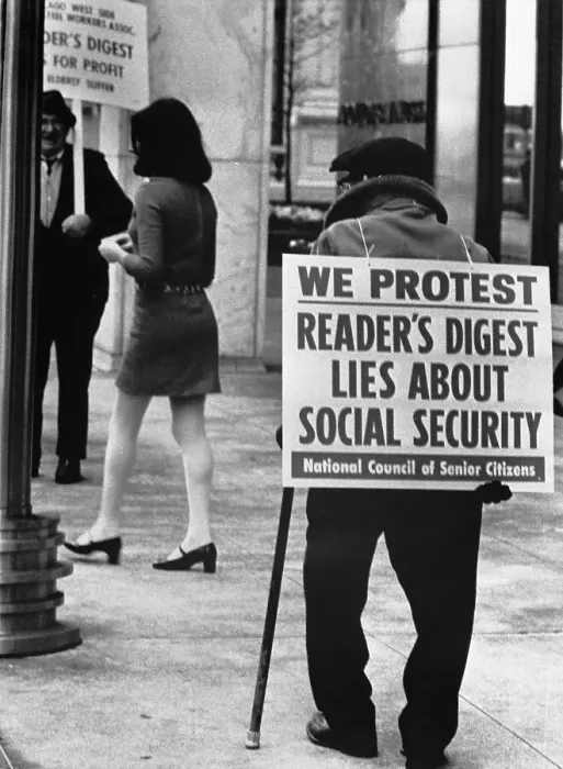 Framed Print : Elderly Protesters Admiring Mini-Skirted Woman Framed Print : Elderly Protesters Admiring Mini-Skirted Woman