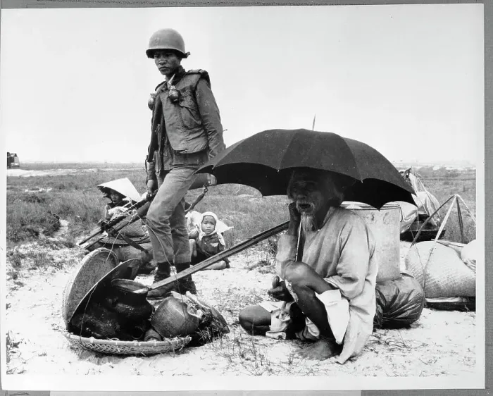 Framed Print : Elderly Vietnamese Man Sits Under Umbrella Framed Print : Elderly Vietnamese Man Sits Under Umbrella
