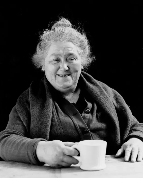 Framed Print : Elderly woman smiling, holding coffee cup, portrait Framed Print : Elderly woman smiling, holding coffee cup, portrait