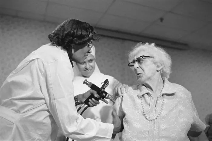 Framed Print : Elderly Woman Wincing As She Is Inoculated for Swine Flu Framed Print : Elderly Woman Wincing As She Is Inoculated for Swine Flu