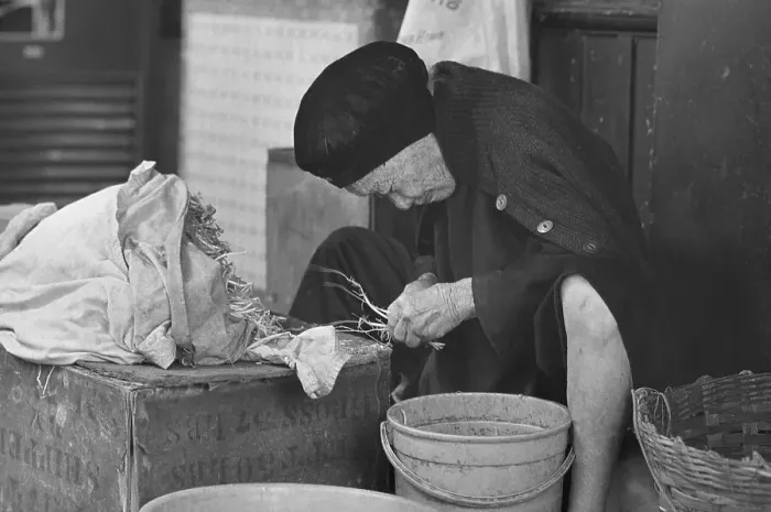 Framed Print : Elderly Woman Working in the Street Framed Print : Elderly Woman Working in the Street
