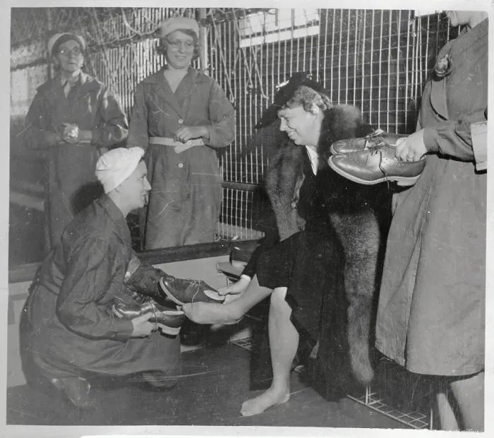 Framed Print : Eleanor Roosevelt Being Helped with Safety Shoes