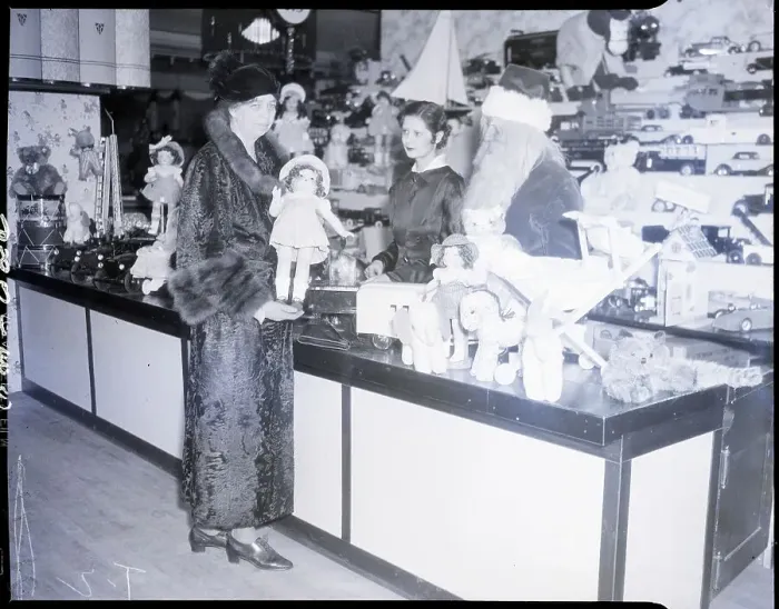 Framed Print : Eleanor Roosevelt with Santa and Doll at Sales Counter Framed Print : Eleanor Roosevelt with Santa and Doll at Sales Counter