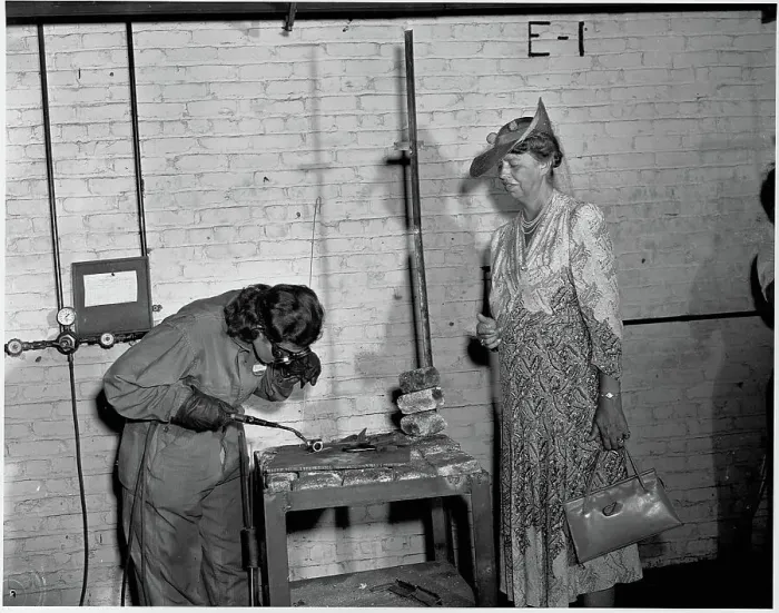 Framed Print : Eleanor Roosevelt Watches a Welding Student Framed Print : Eleanor Roosevelt Watches a Welding Student