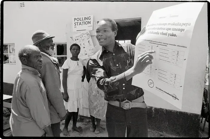 Framed Print : Election Official Pointing at Ballot Sign Framed Print : Election Official Pointing at Ballot Sign