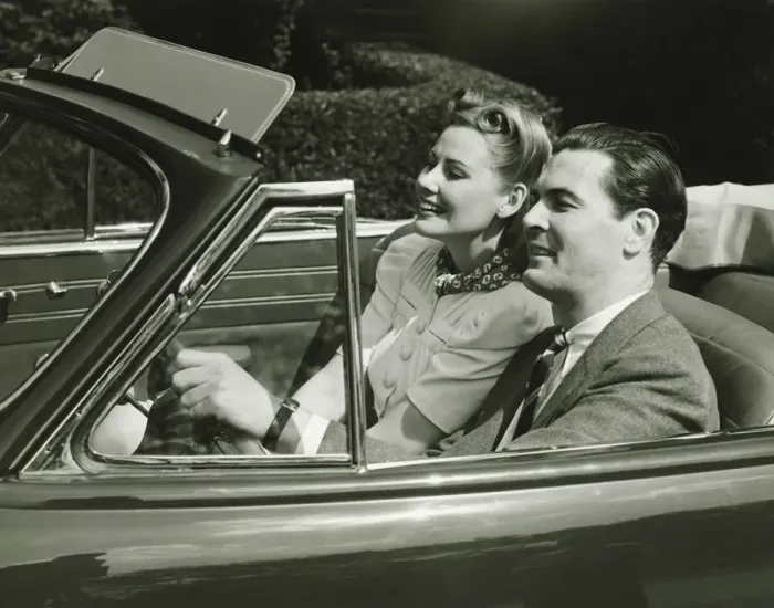 Framed Print : Elegant couple riding in in convertible car, (B&W) Framed Print : Elegant couple riding in in convertible car, (B&W)