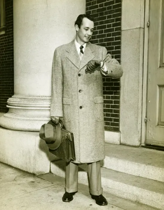 Framed Print : Elegant man checking watch at entrance to building, (B&W)