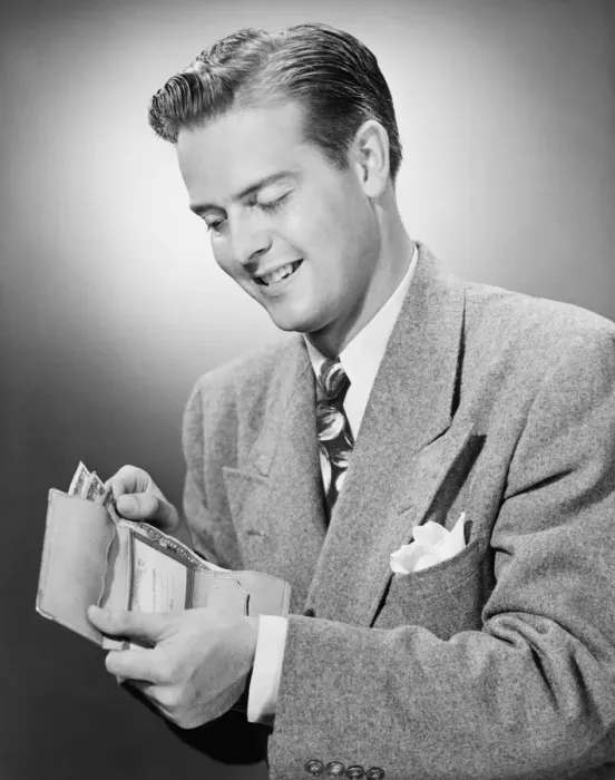 Framed Print : Elegant man putting US dollars bills into wallet, (B&W) Framed Print : Elegant man putting US dollars bills into wallet, (B&W)