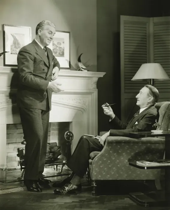 Framed Print : Two elegant men talking by fireplace, (B&W) Framed Print : Two elegant men talking by fireplace, (B&W)