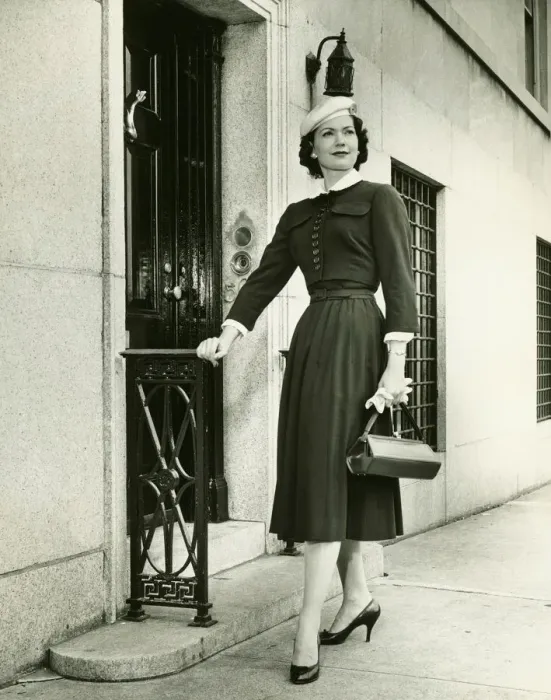 Framed Print : Elegant woman posing at building entrance, (B&W), portrait
