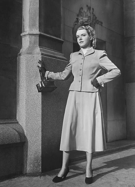 Elegant woman standing at Sutton Place NYC, (B&W)