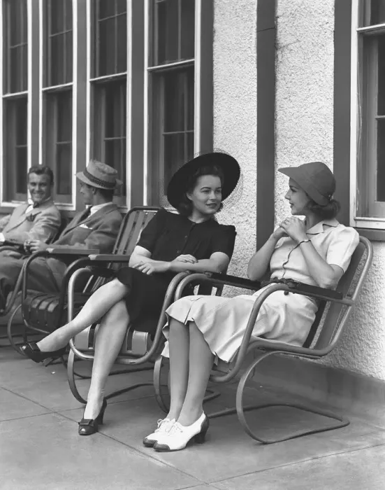 Framed Print : Two elegant women sitting on armchairs outdoors, (B&W)