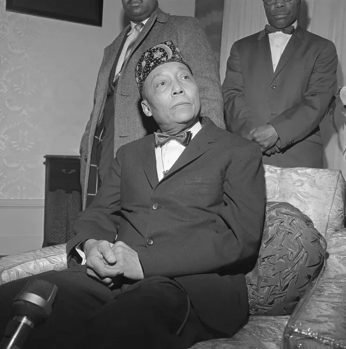 Framed Print : Elijah Muhammad Sitting with Hands Clasped Framed Print : Elijah Muhammad Sitting with Hands Clasped