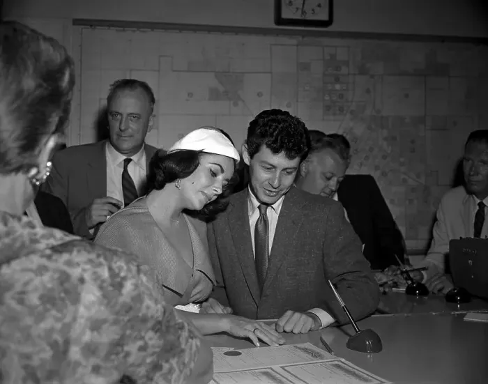 Framed Print : Elizabeth Taylor and Eddie Fisher Reading Marriage License Framed Print : Elizabeth Taylor and Eddie Fisher Reading Marriage License