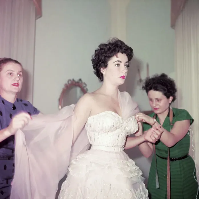 Framed Print : Elizabeth Taylor Having Shawl Placed on her Shoulders Framed Print : Elizabeth Taylor Having Shawl Placed on her Shoulders