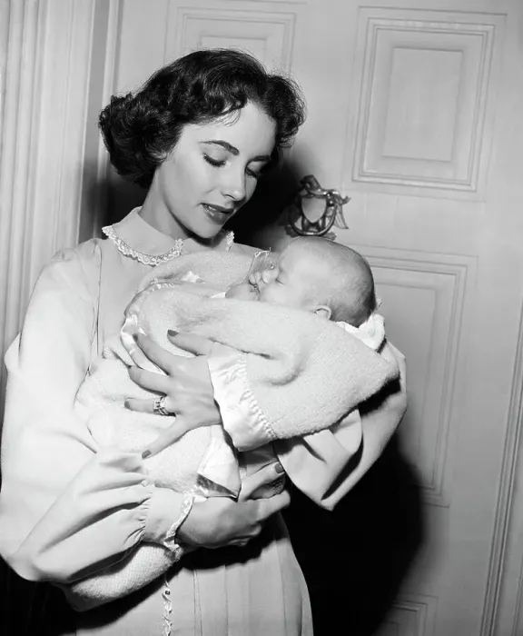 Framed Print : Elizabeth Taylor Holds Baby for Movie Framed Print : Elizabeth Taylor Holds Baby for Movie