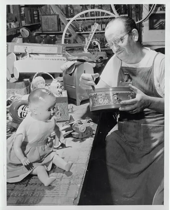 Framed Print : Elliott Hayden Repairing Toys Framed Print : Elliott Hayden Repairing Toys