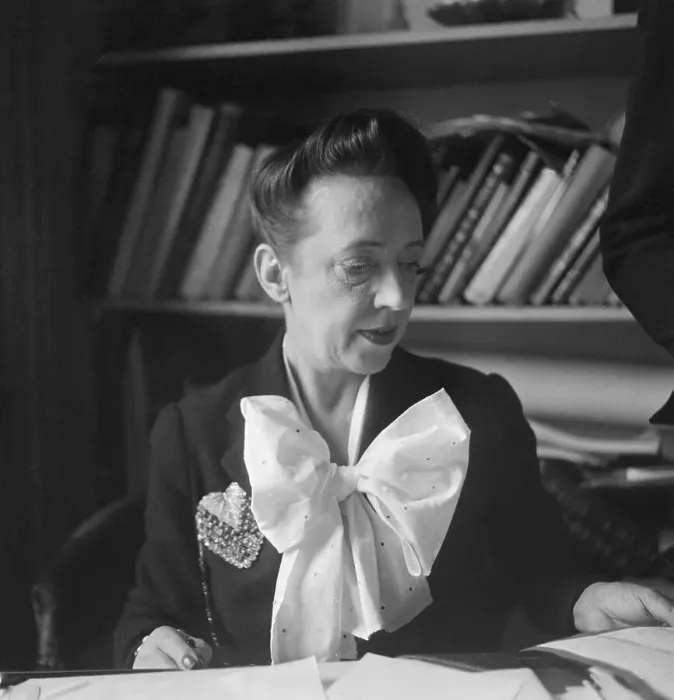 Framed Print : Elsa Schiaparelli Sitting in Front of Bookshelf Framed Print : Elsa Schiaparelli Sitting in Front of Bookshelf