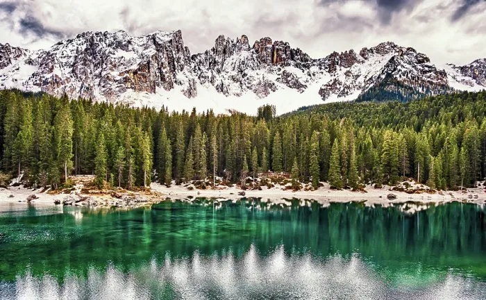Framed Print : The emerald green Lake Carezza reflects the trees in the western Dolomite mountains of northern Italy Framed Print : The emerald green Lake Carezza reflects the trees in the western Dolomite mountains of northern Italy