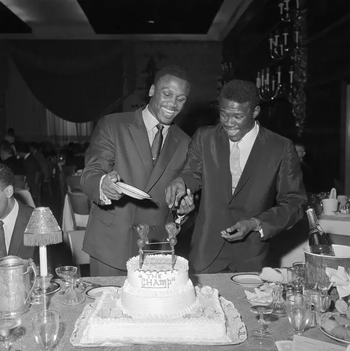 Framed Print : Emile Griffith Cutting Cake for Joe Frazier Framed Print : Emile Griffith Cutting Cake for Joe Frazier