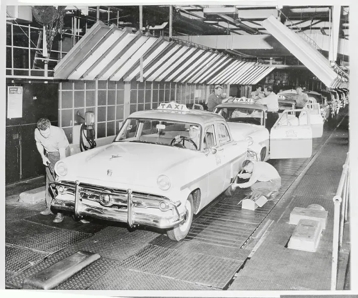 Framed Print : Employees Working on Car Assembly Line Framed Print : Employees Working on Car Assembly Line