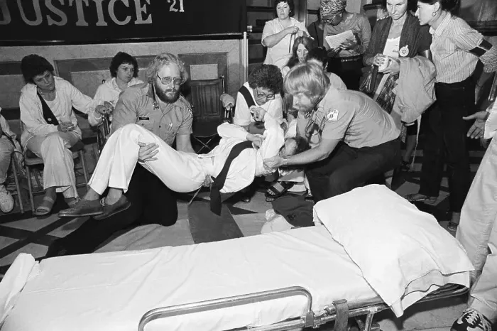Framed Print : EMT's Lifting Woman onto Stretcher Framed Print : EMT's Lifting Woman onto Stretcher