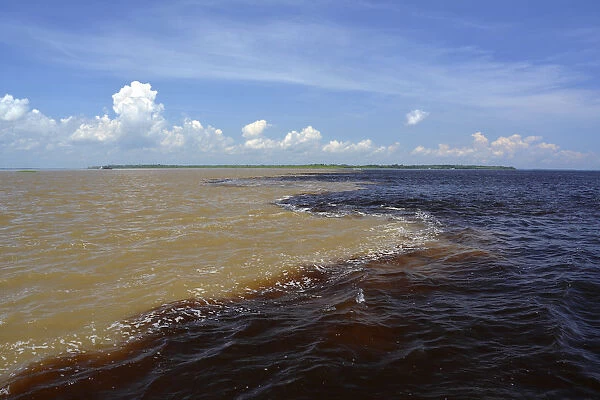 Encontro das Aguas, the Meeting of Waters, the confluence of the white water river Rio Solimoes and black water river Rio Negro, further down river is called Amazon, Manaus, Amazonas State, Brazil