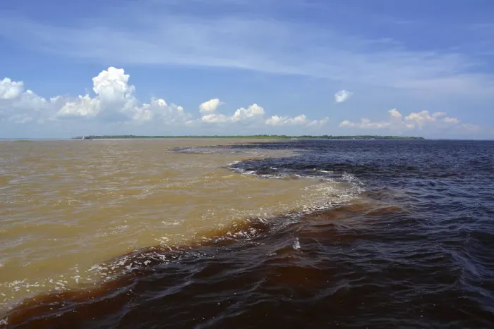 Framed Print : Encontro das Aguas, the Meeting of Waters, the confluence of the white water river Rio Solimoes and black water river Rio Negro, further down river is called Amazon, Manaus, Amazonas State, Brazil