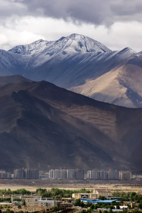 Framed Print : The enormous mountain range and the new city of Lhasa Framed Print : The enormous mountain range and the new city of Lhasa