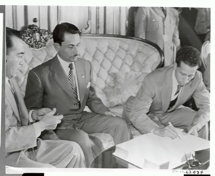 Framed Print : Enrique Oliva Signing a Document Framed Print : Enrique Oliva Signing a Document