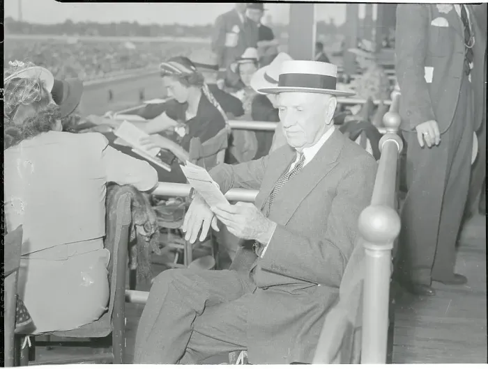 Framed Print : E.R. Bradley Reading Papers at Race Framed Print : E.R. Bradley Reading Papers at Race
