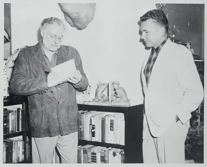 Framed Print : Ernest Hemingway Autographing Book Framed Print : Ernest Hemingway Autographing Book