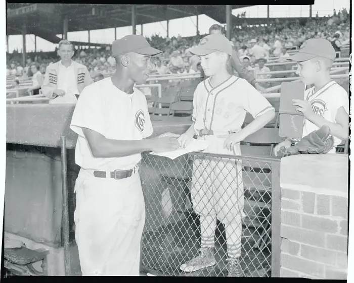 Framed Print : Ernie Banks Signing an Autograph Framed Print : Ernie Banks Signing an Autograph