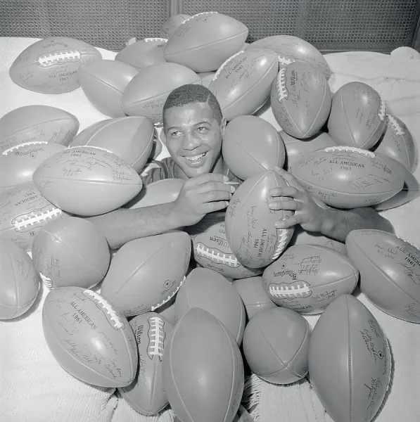 Ernie Davis Buried Beneath Footballs Art Prints, Posters