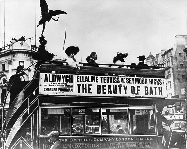 Eros Bus. 1909: The silhouette of the Eros statue hovers above passengers