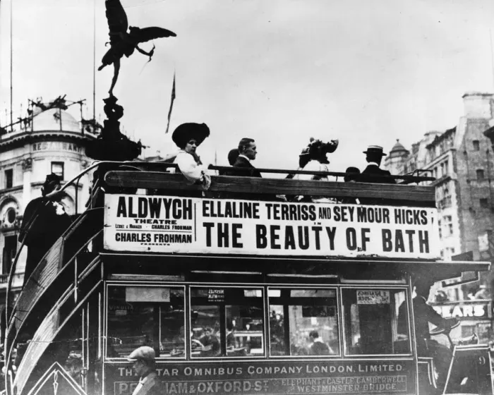 Framed Print : Eros Bus. 1909: The silhouette of the Eros statue hovers above passengers Framed Print : Eros Bus. 1909: The silhouette of the Eros statue hovers above passengers