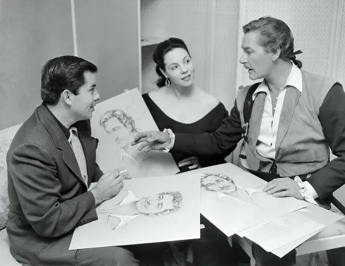 Framed Print : Errol Flynn, Mil Patrick, and Bud Westmore Discussing Sketches Framed Print : Errol Flynn, Mil Patrick, and Bud Westmore Discussing Sketches