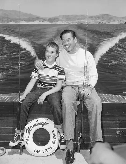 Framed Print : Errol Flynn and Son Posin on Boat Framed Print : Errol Flynn and Son Posin on Boat