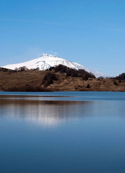 Etna Volcano mirroring on a lake