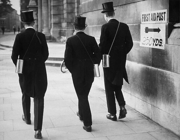 Eton Boys. 1939: Schoolboys from Eton, wearing their gas masks in the post