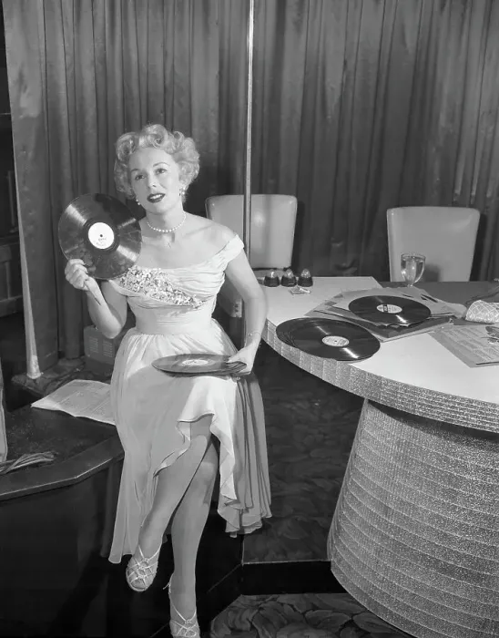Framed Print : Eva Gabor Holding Records Framed Print : Eva Gabor Holding Records